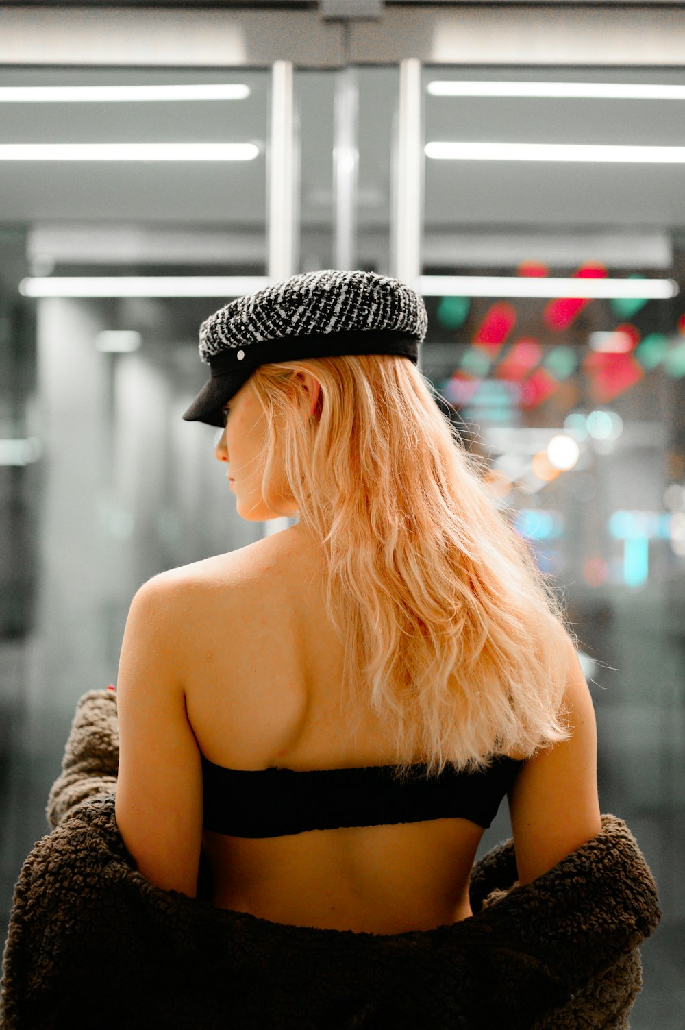 woman in black and white knit cap