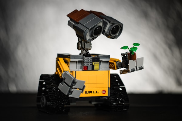 Wall-E holding a potted plant