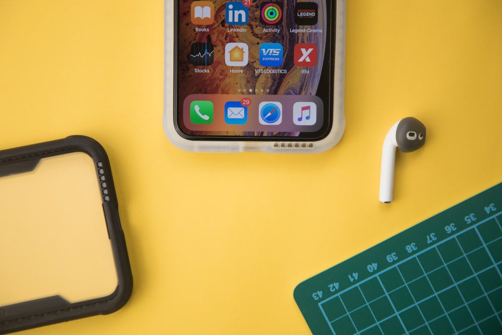 silver iphone 6 on yellow table