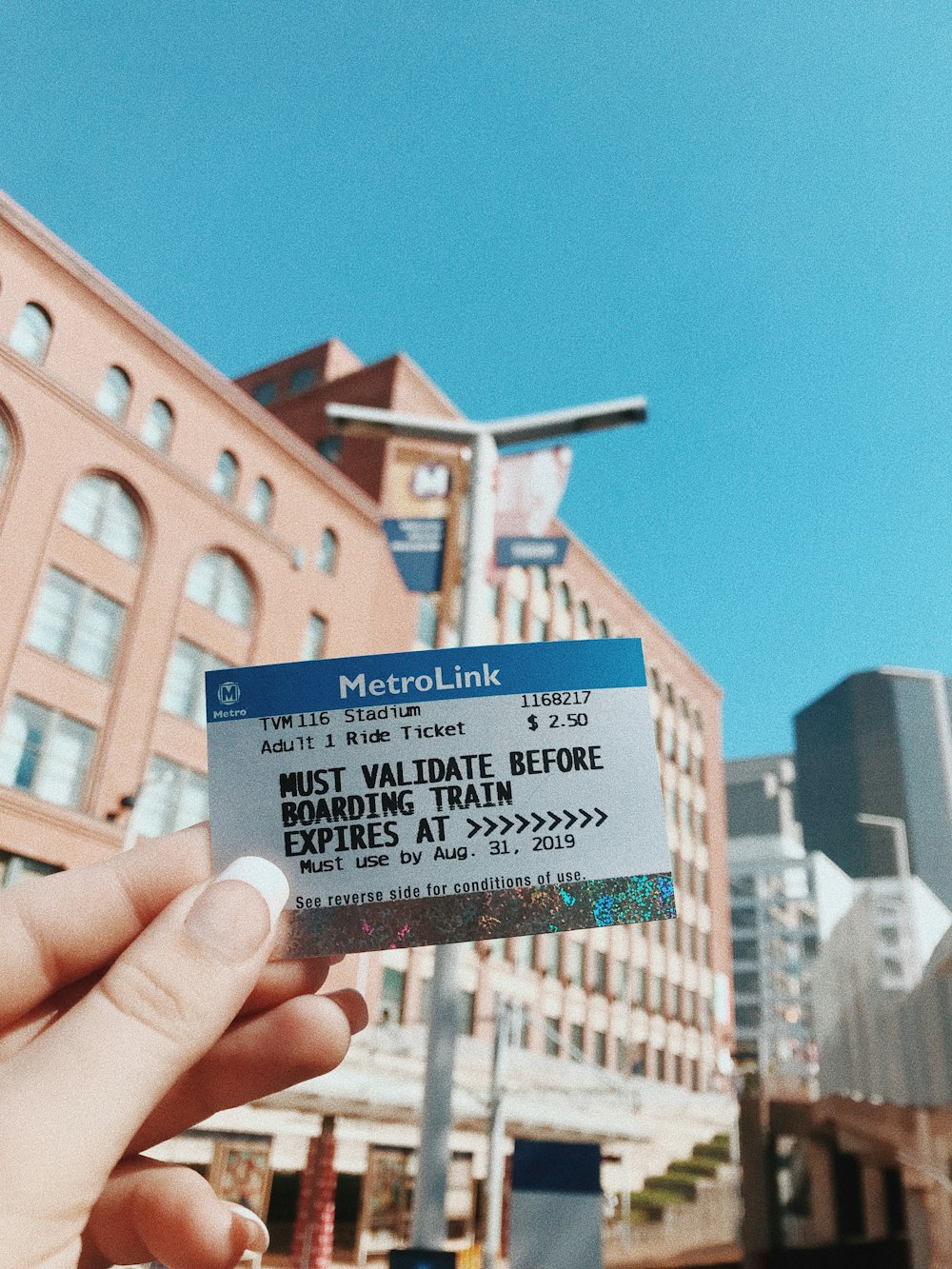 person holding blue and white card