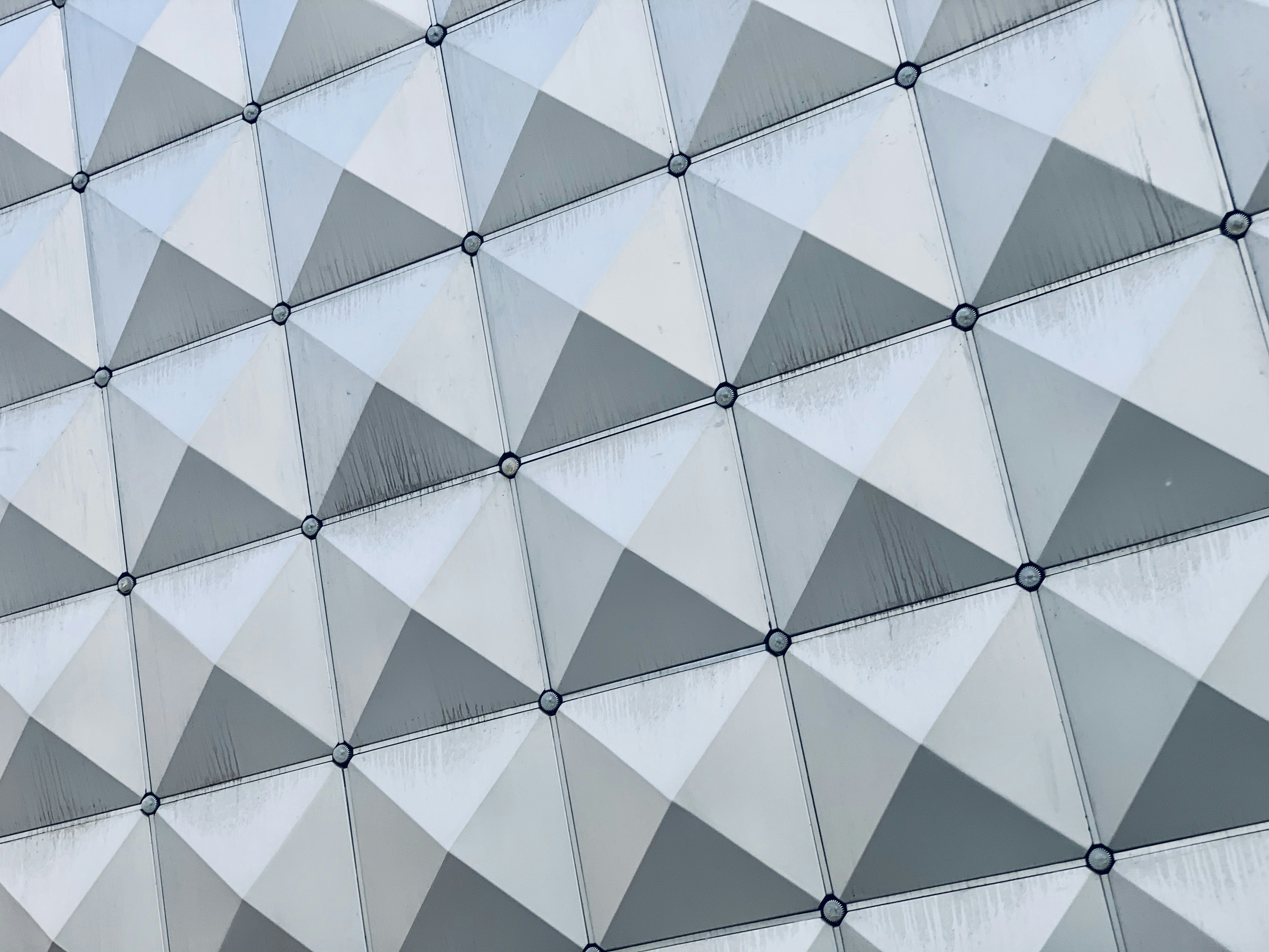 white and gray concrete building triangle teams background