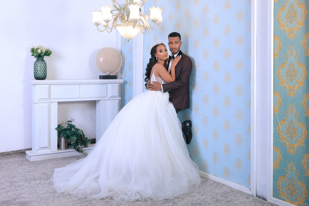 woman in white wedding gown beside woman in black sleeveless dress