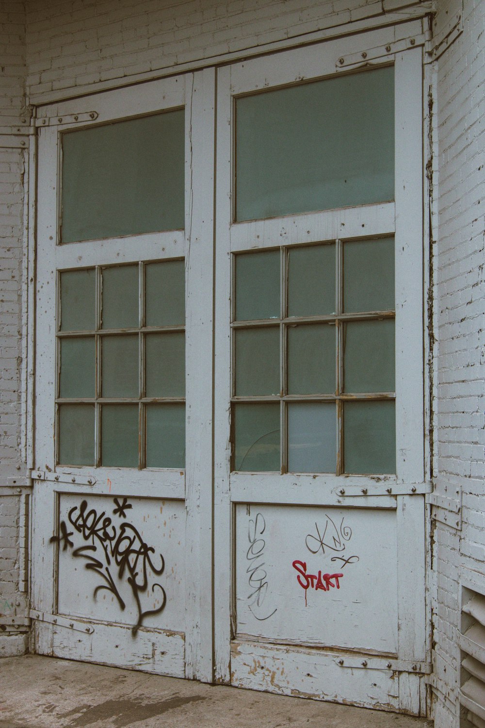 white wooden framed glass window