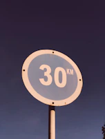 White circular sign with a red border indicating speed limit of 50 km/h.
