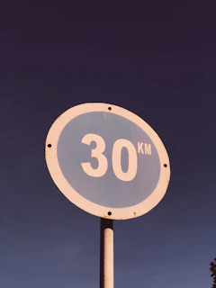 White circular sign with a red border indicating speed limit of 50 km/h.