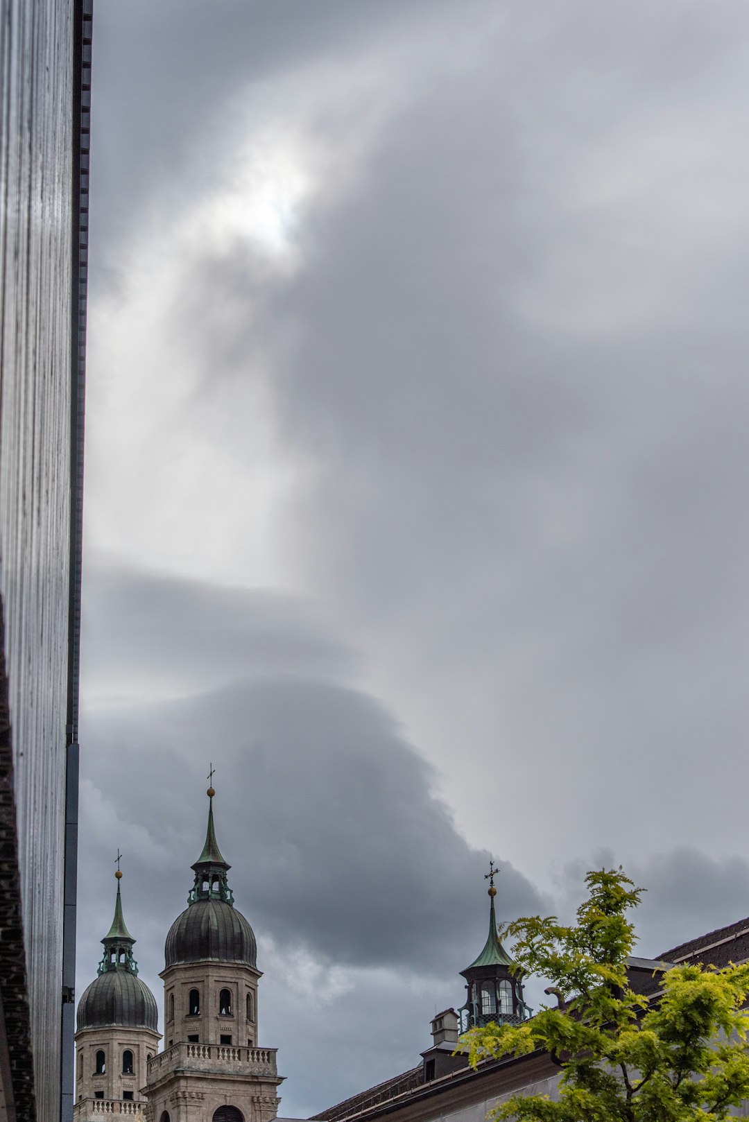 gray concrete tower under white clouds