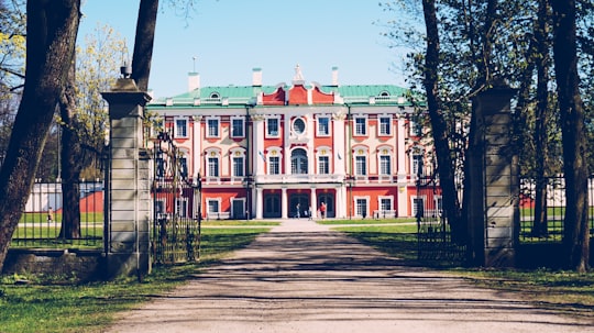 green and brown concrete building in Kadriorg Park Estonia