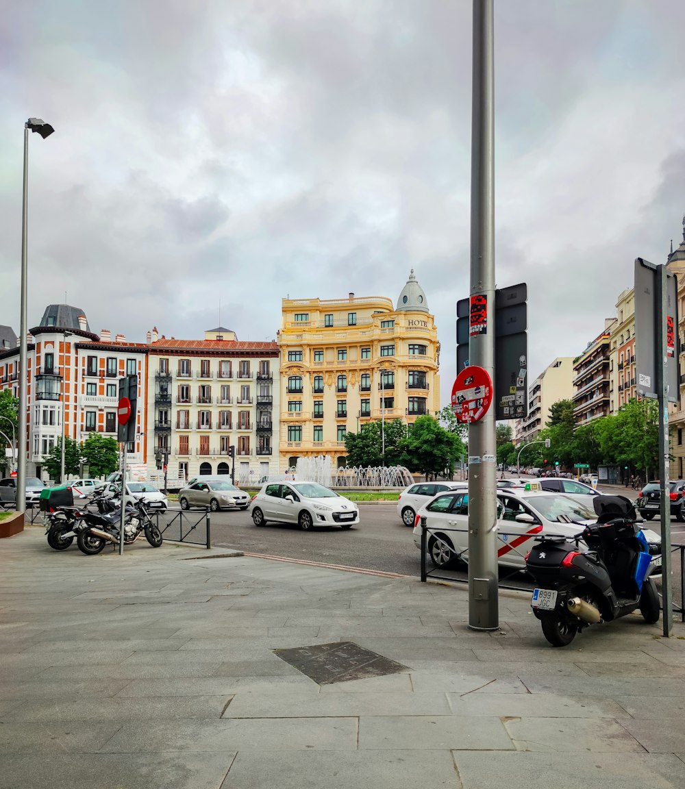 cars parked on parking lot near brown concrete building during daytime