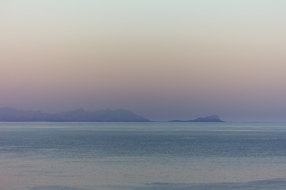 blue sea under blue sky during daytime