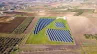 A landscape view of solar farms stretching across the horizon.