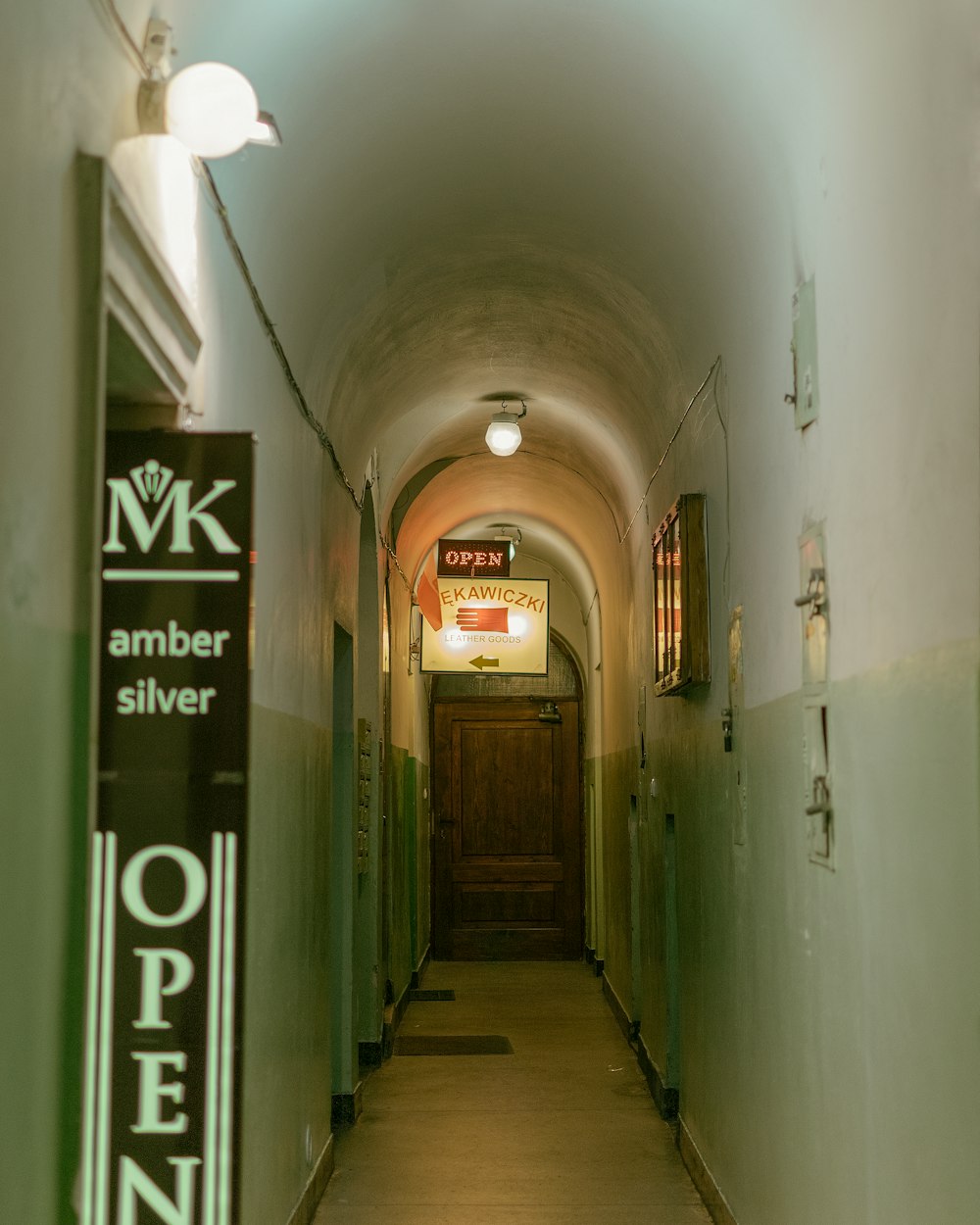 hallway with green metal doors