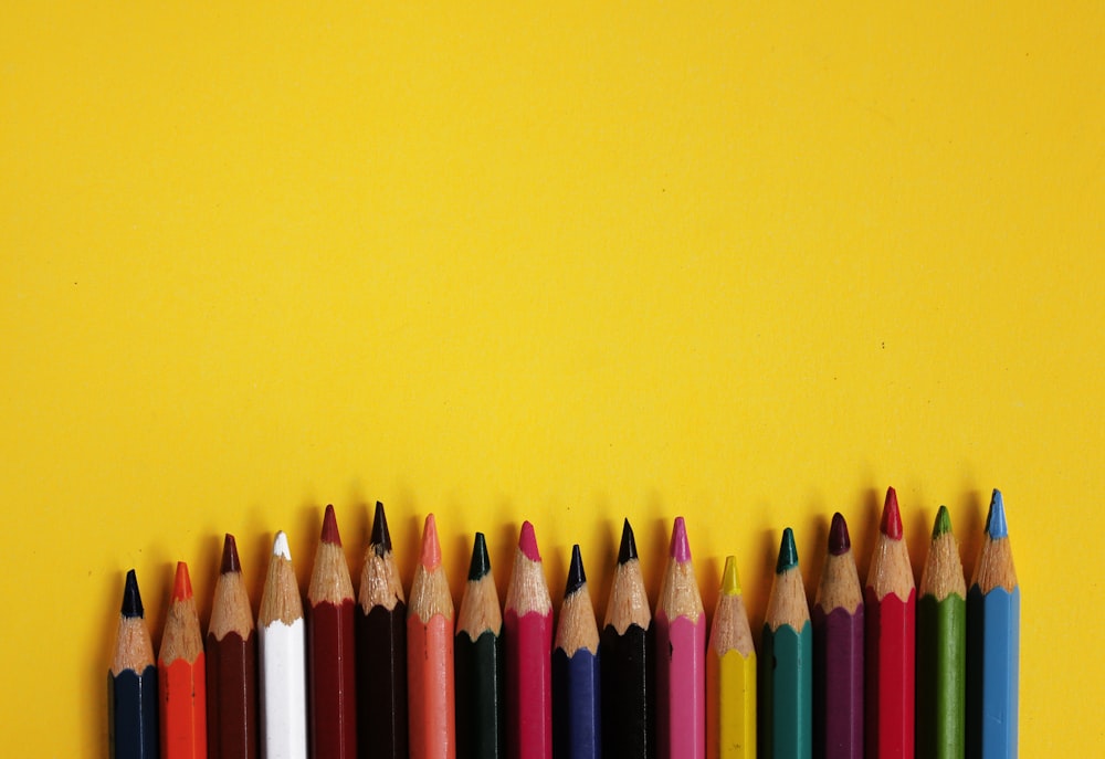 yellow blue and purple color pencils