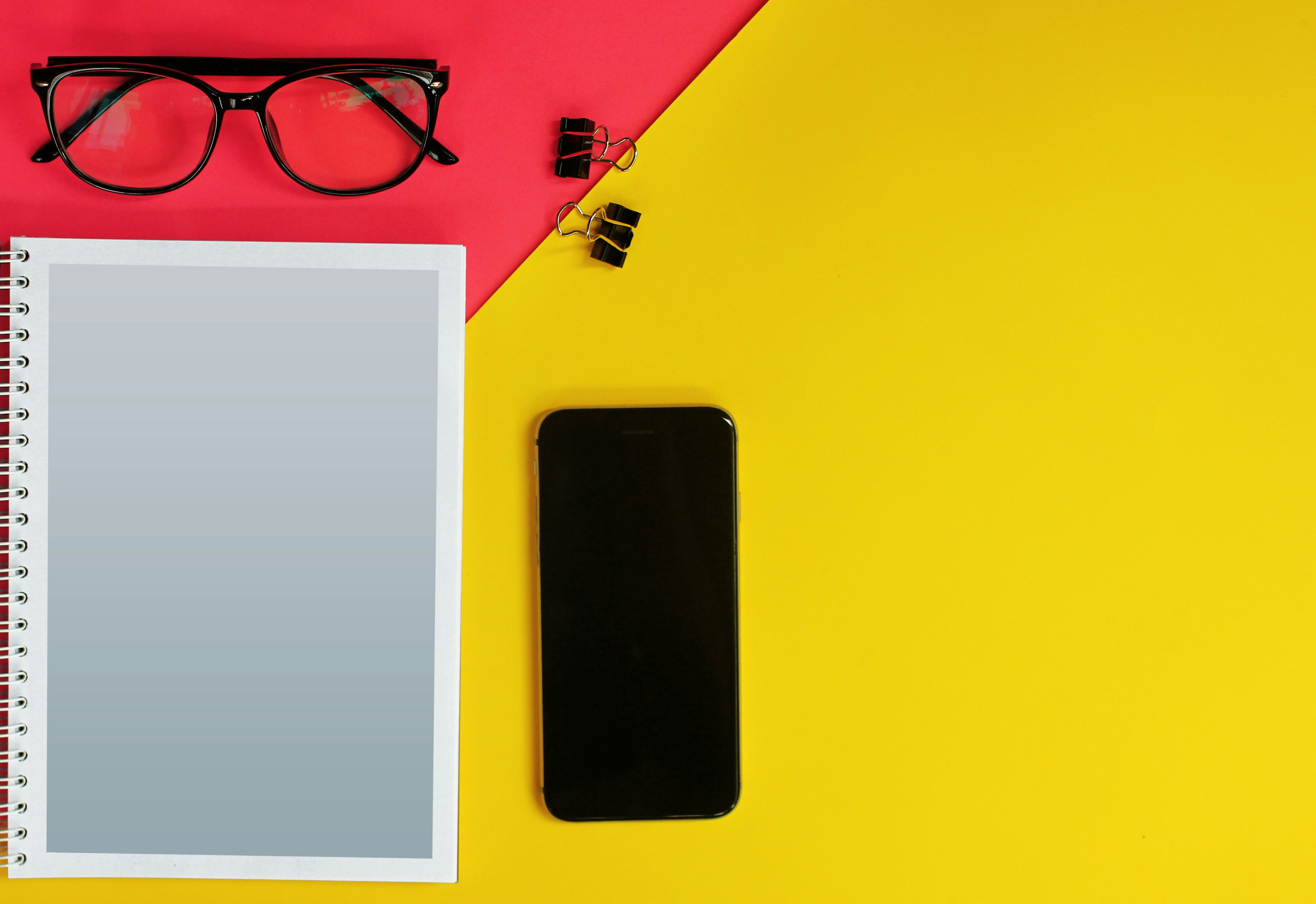 black iphone 5 on yellow table