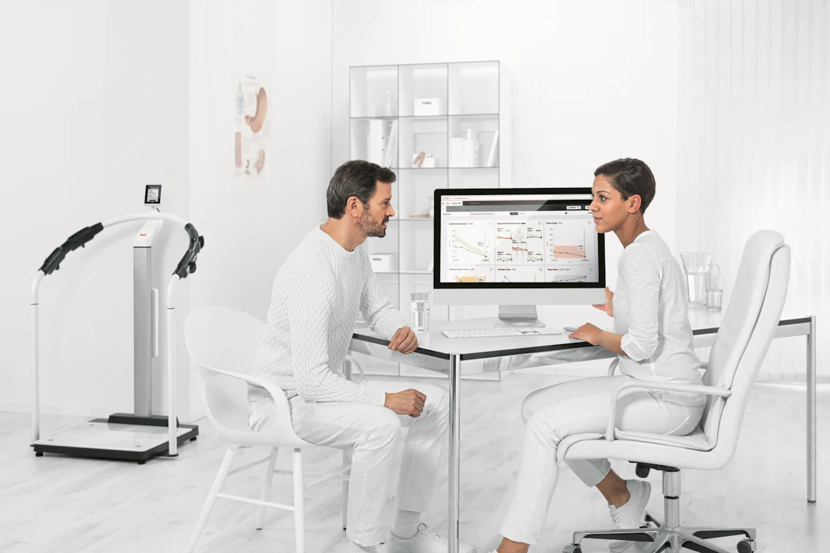 A modern consultation room with a screen-based setup