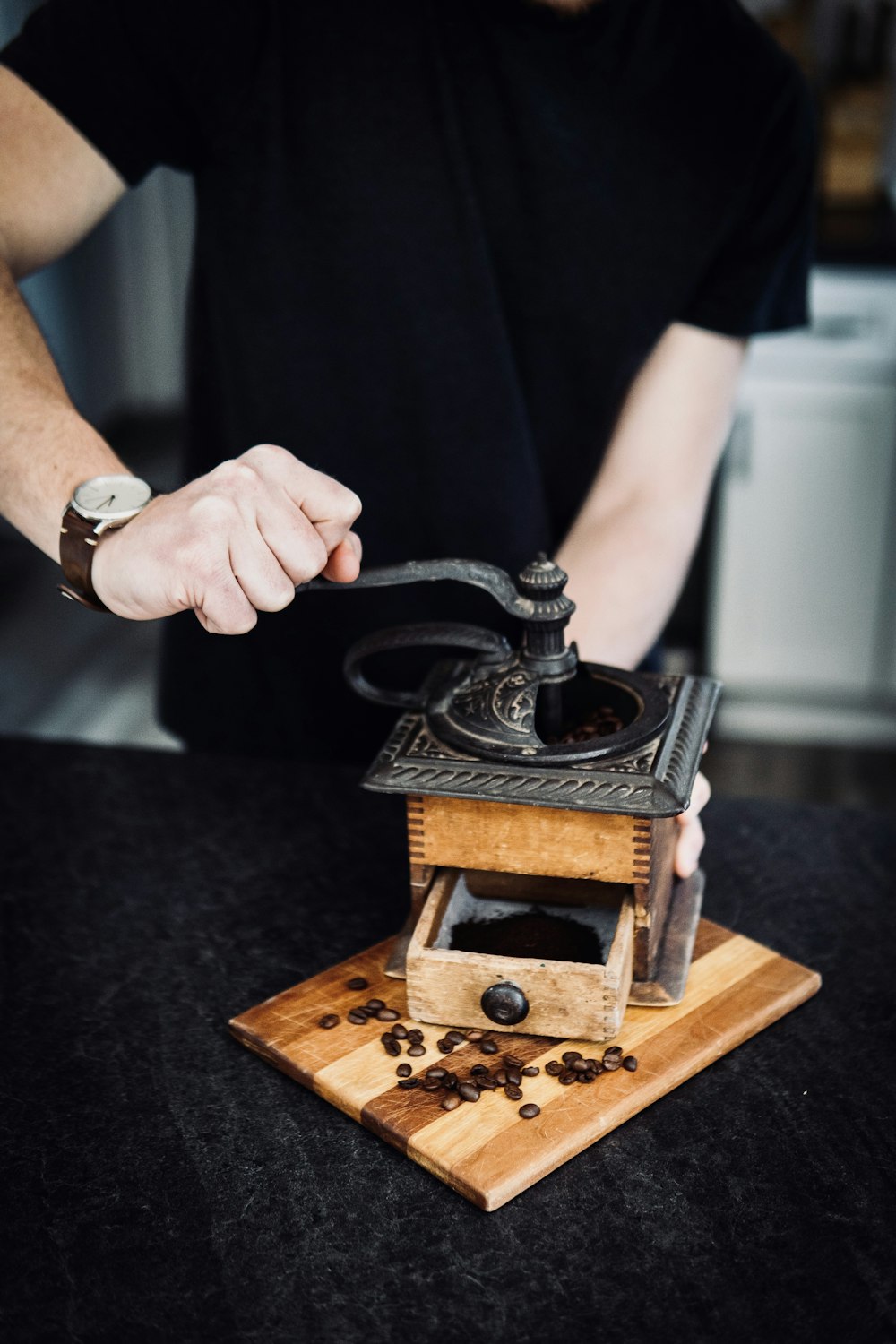 person holding black and brown metal tool