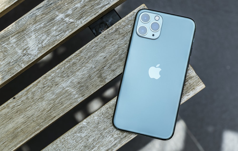 blue iphone 5 c on gray wooden surface
