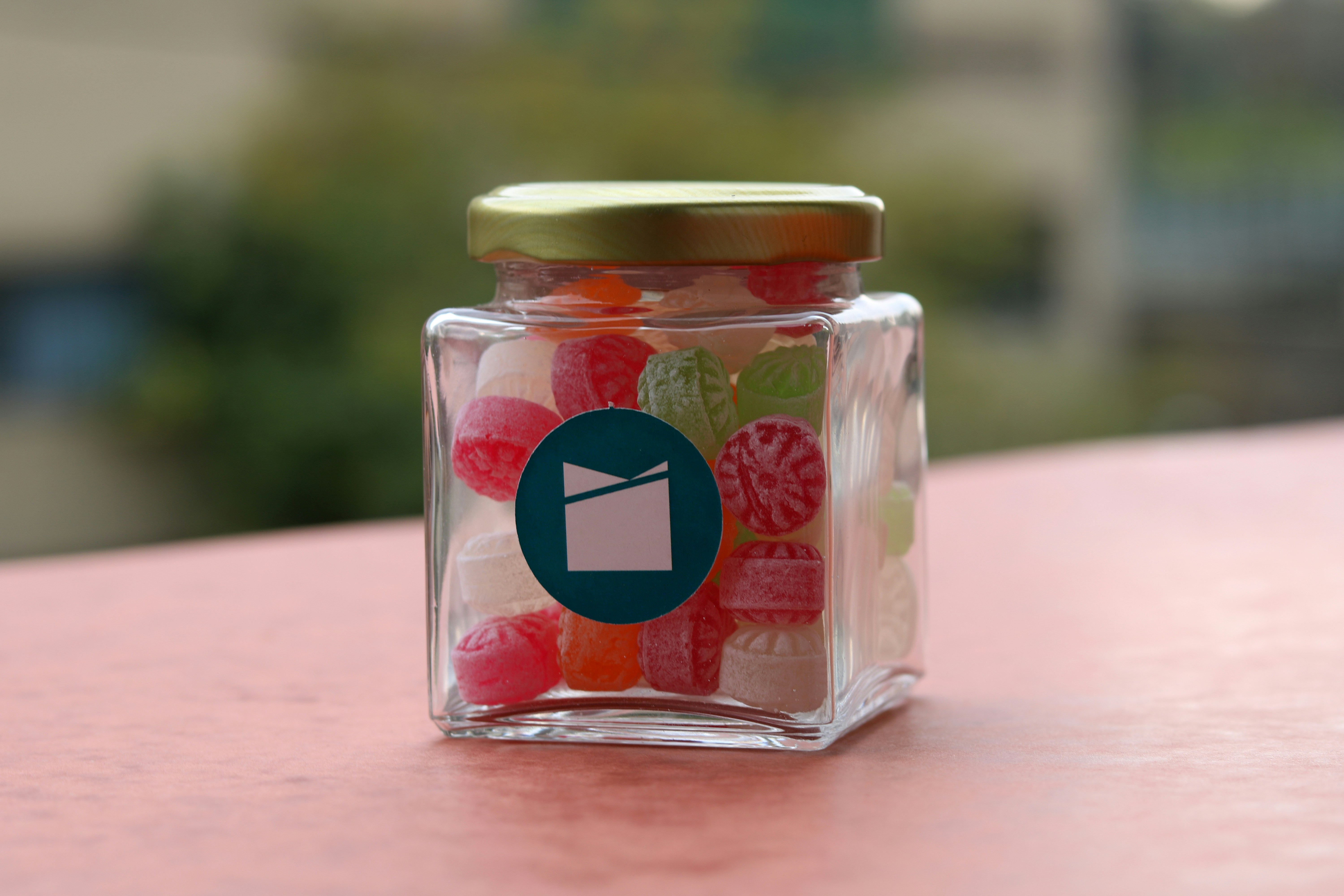 clear glass jar with red heart print