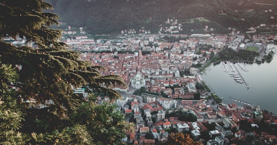 aerial view of city buildings during daytime in Lake Como Italy