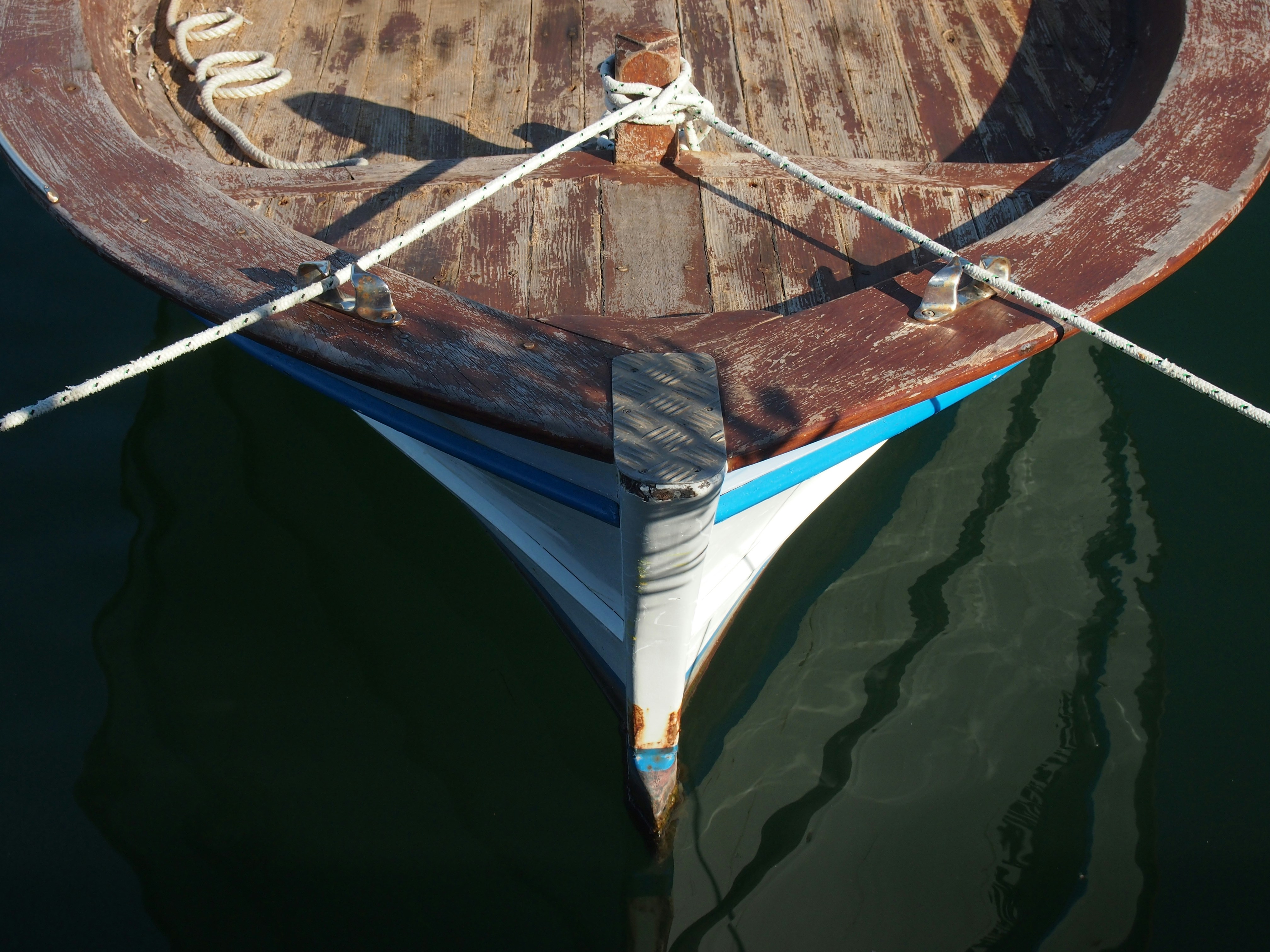 blue and white boat on water
