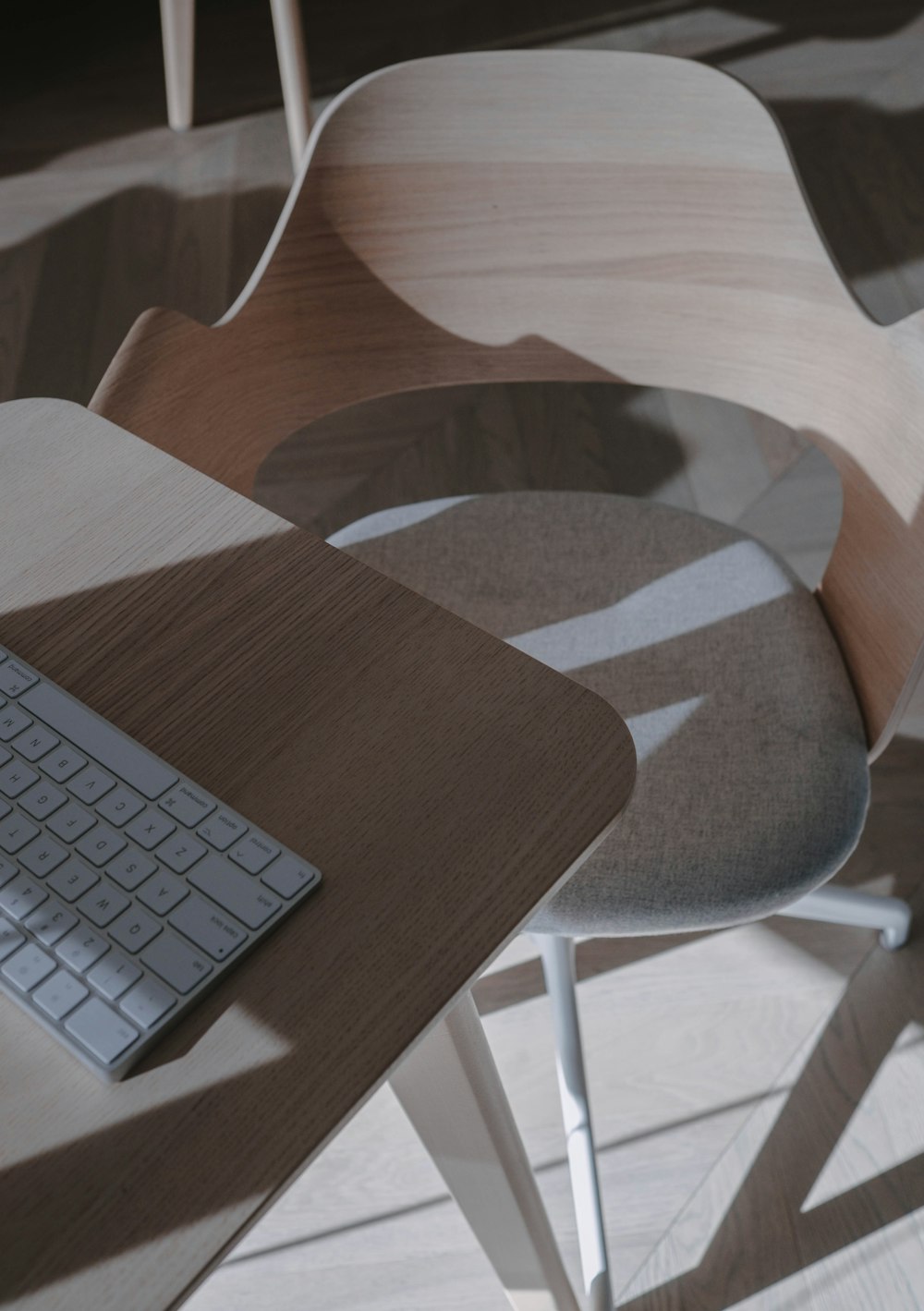 apple magic keyboard on brown wooden table