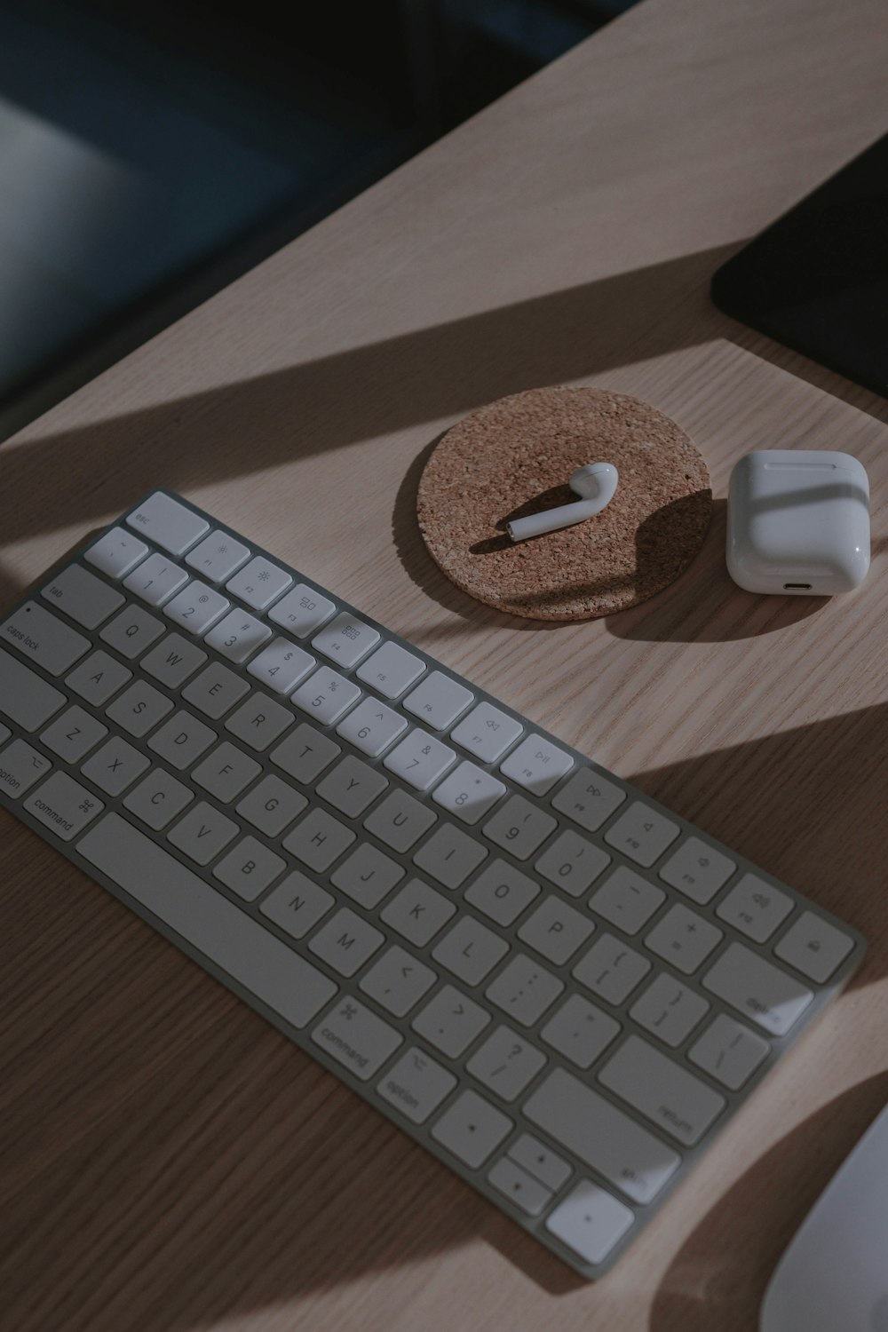 apple magic keyboard on brown wooden table