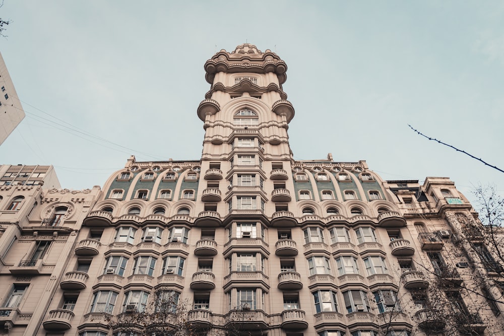 a very tall building with many windows and balconies