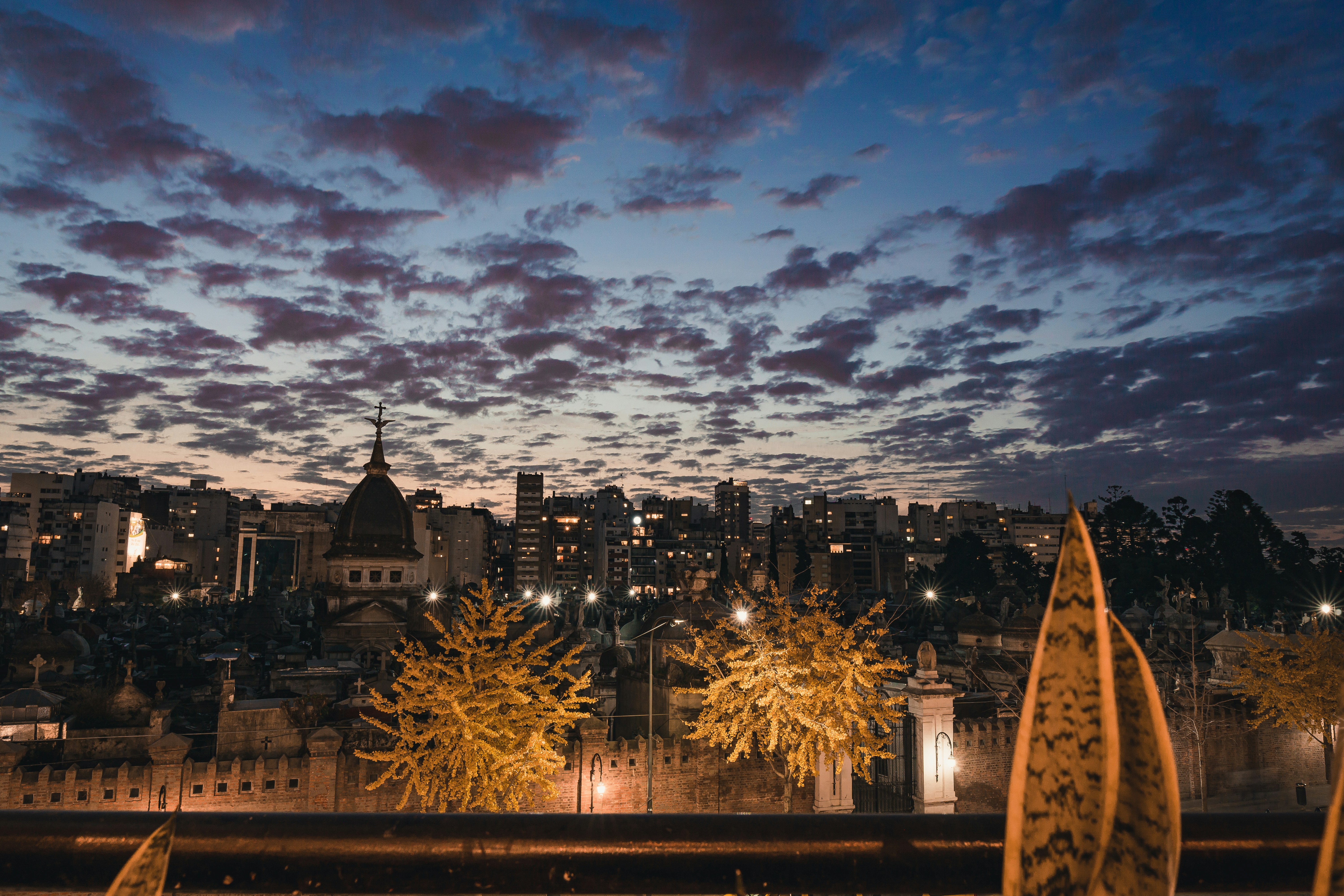 a view of a city at night from a balcony
