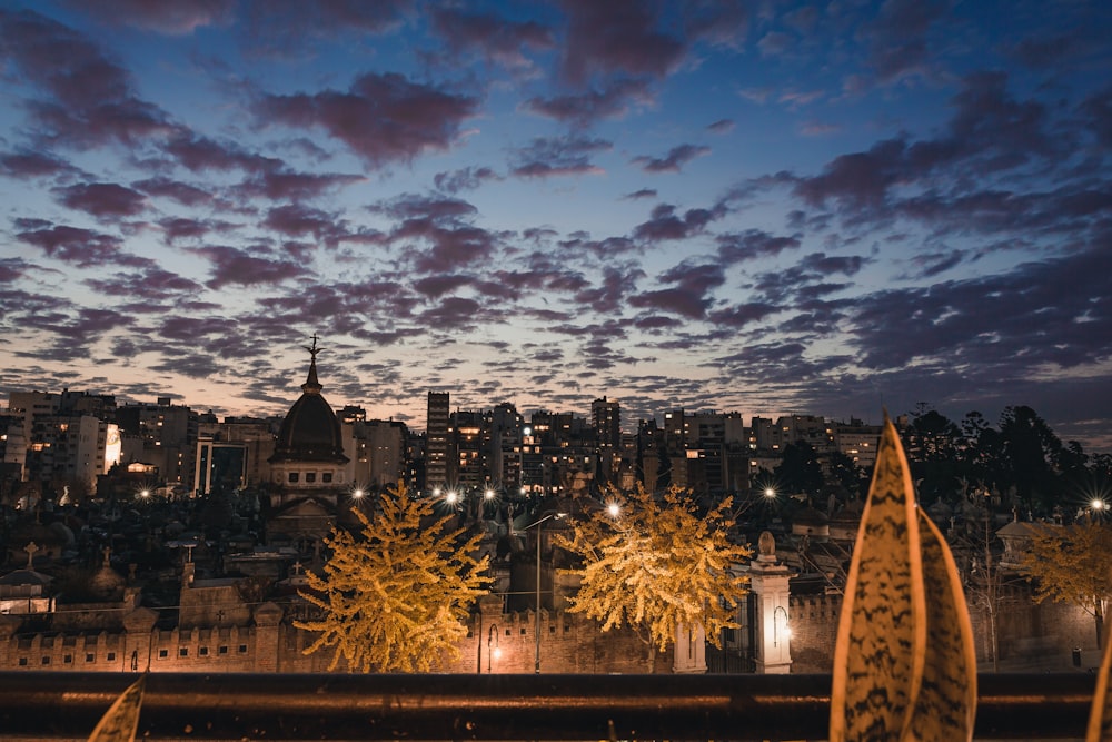 a view of a city at night from a balcony