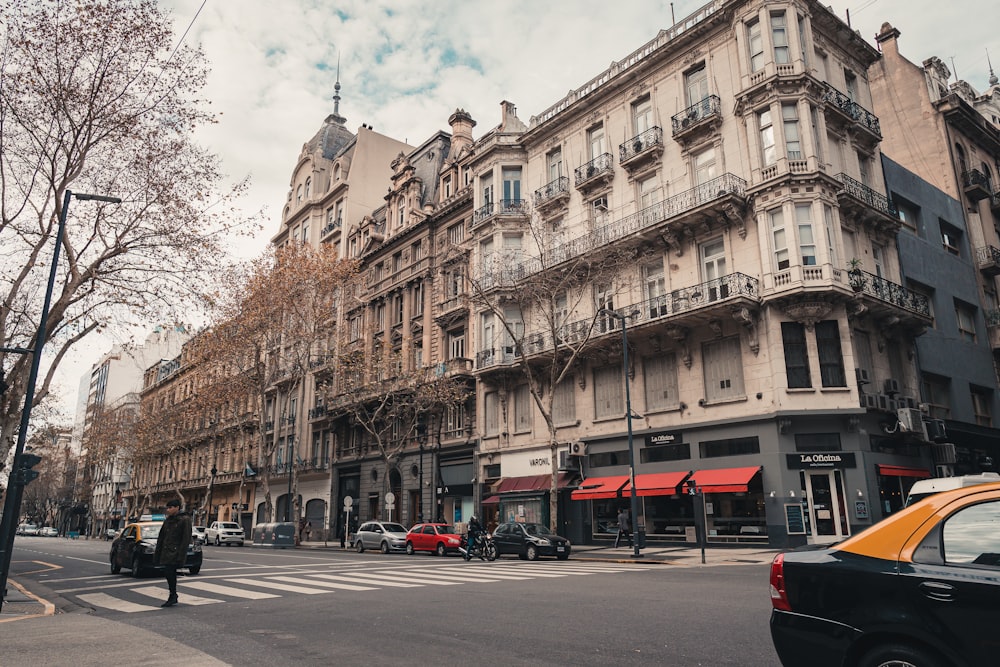 a city street filled with lots of tall buildings