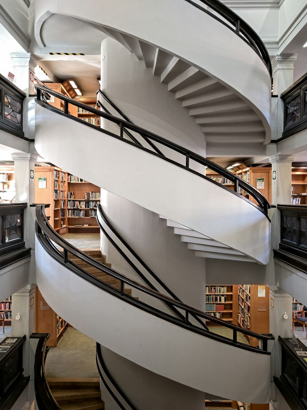 white and brown spiral staircase