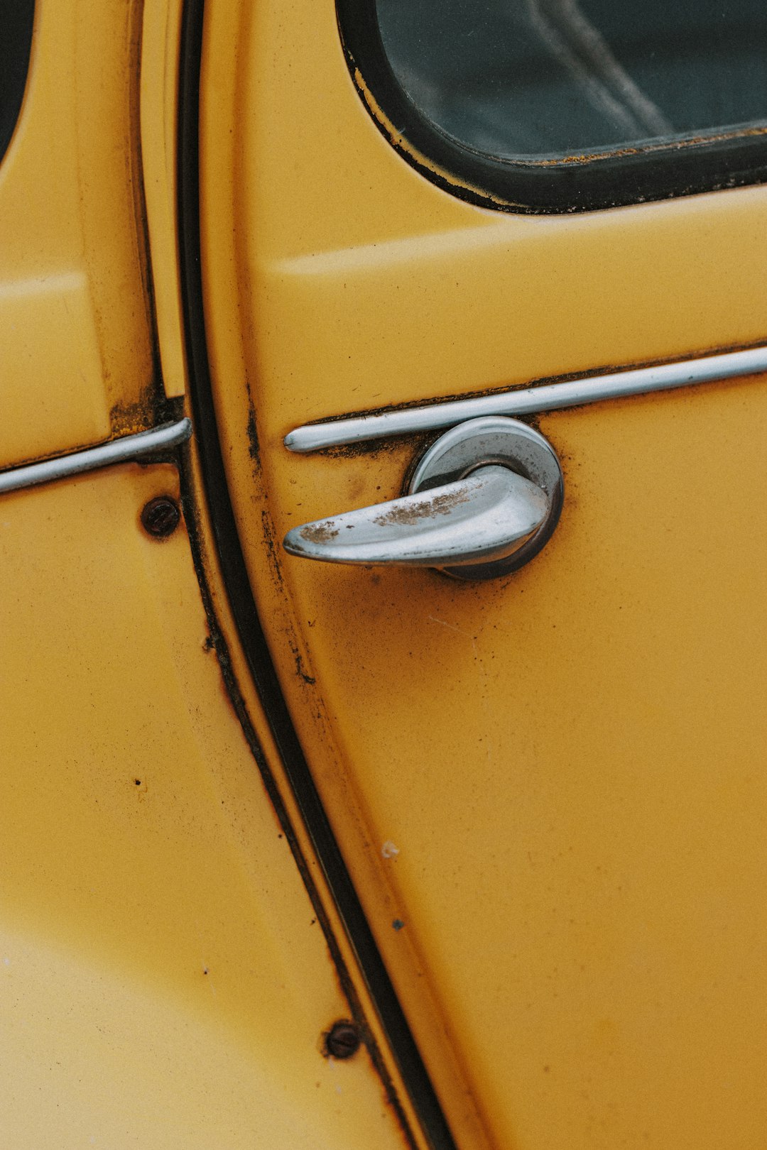 yellow and silver door lever