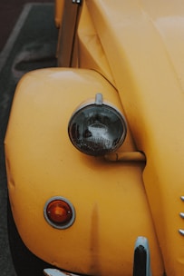 A close-up of a damaged car fender showing signs of a past accident.