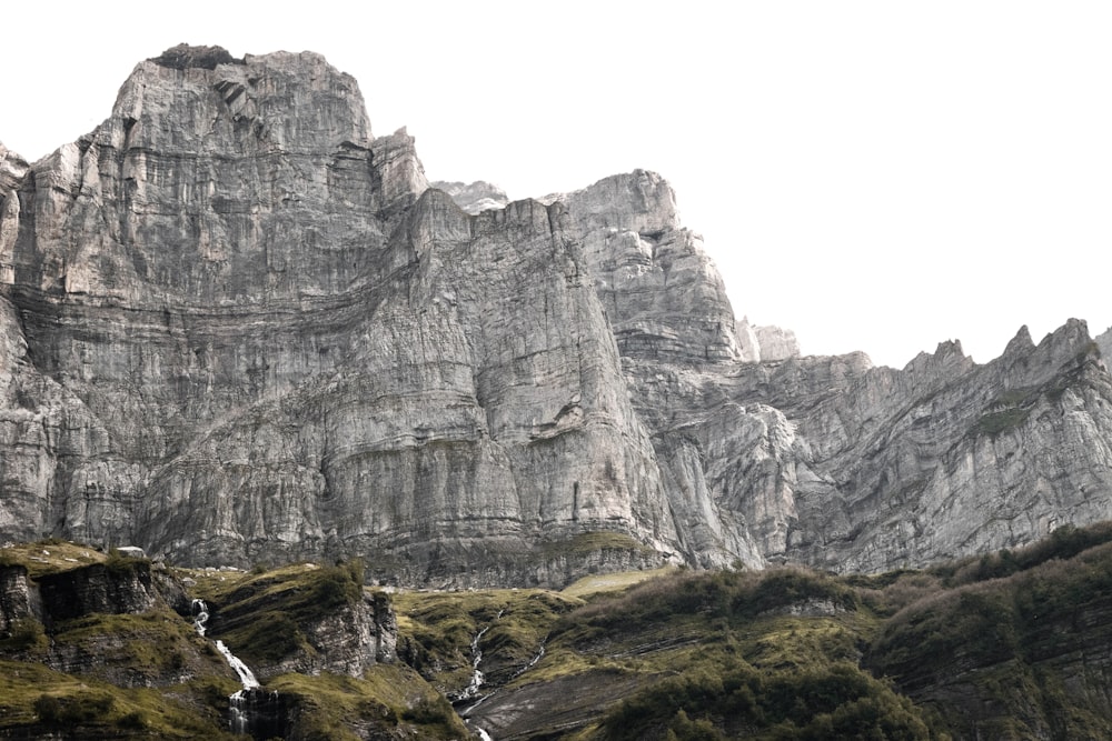 gray rocky mountain under white sky during daytime