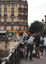 A vibrant street view of local businesses in Saône-et-Loire bustling with customers.