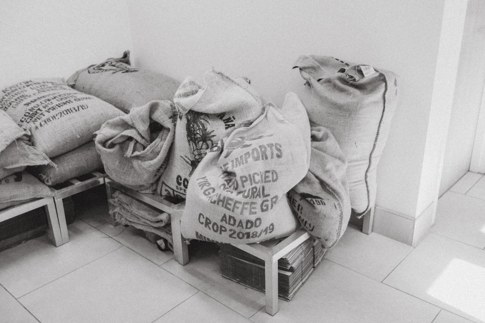 white and black plastic bags on white plastic seat