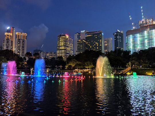 water fountain in the city during night time in KLCC Park Malaysia