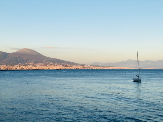 boat on sea near island during daytime in Fontana del Sebeto Italy