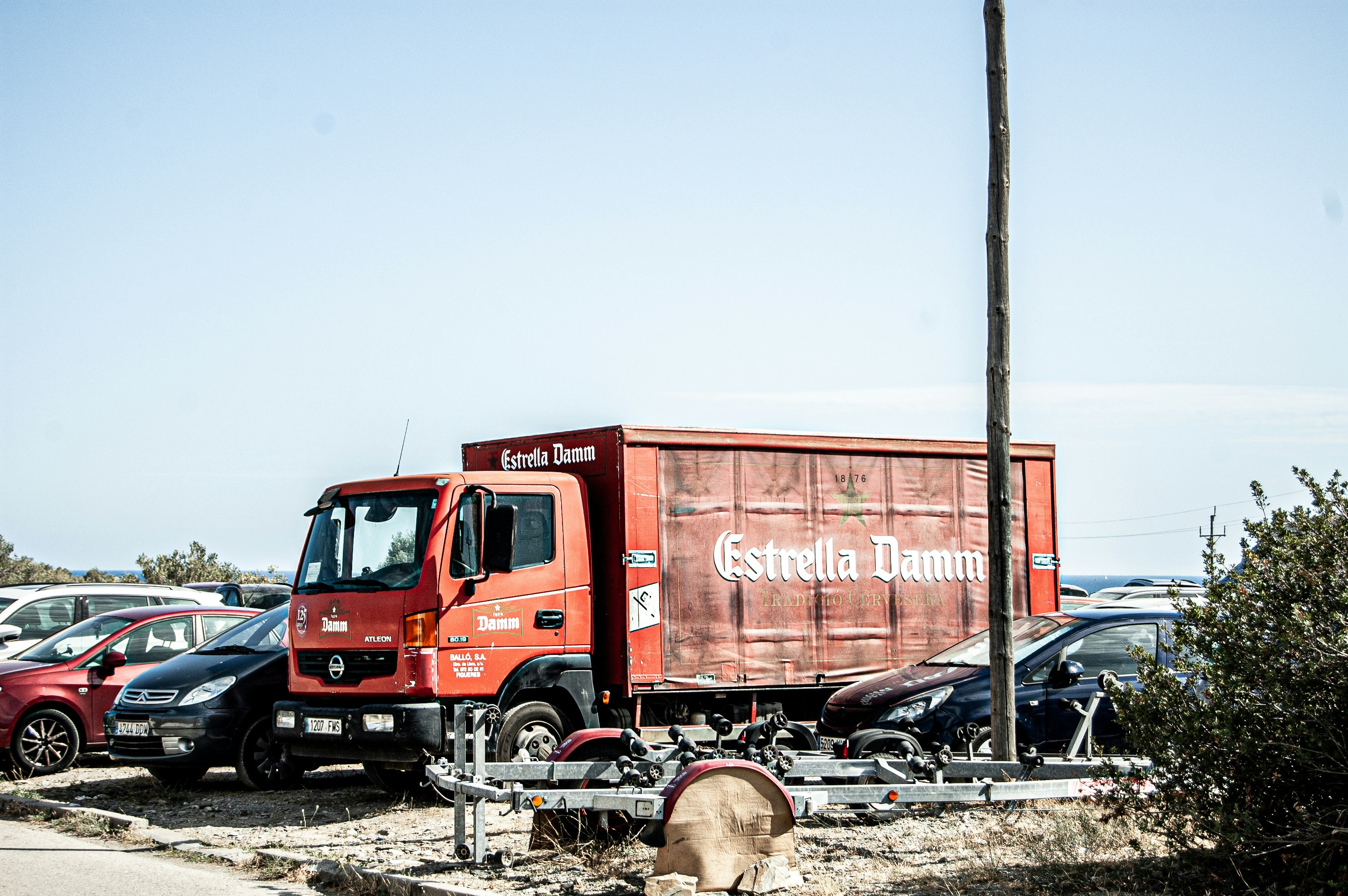 red truck on gray sand during daytime