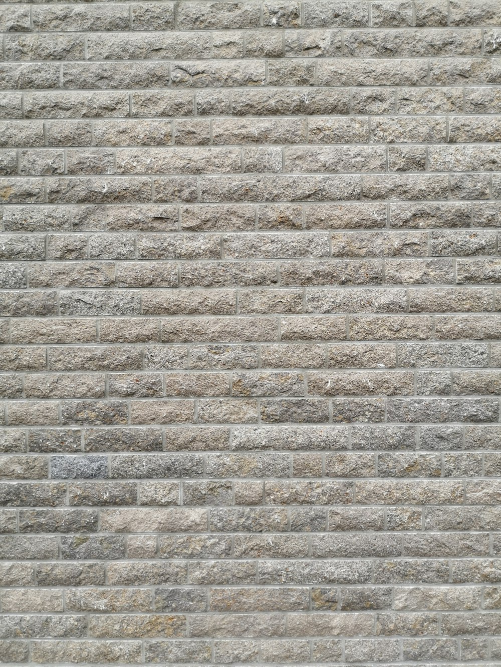 brown and gray brick wall