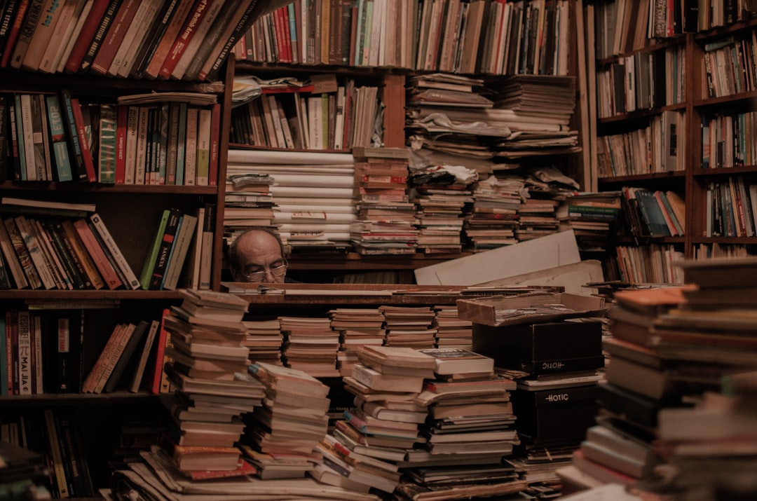 books on brown wooden shelf