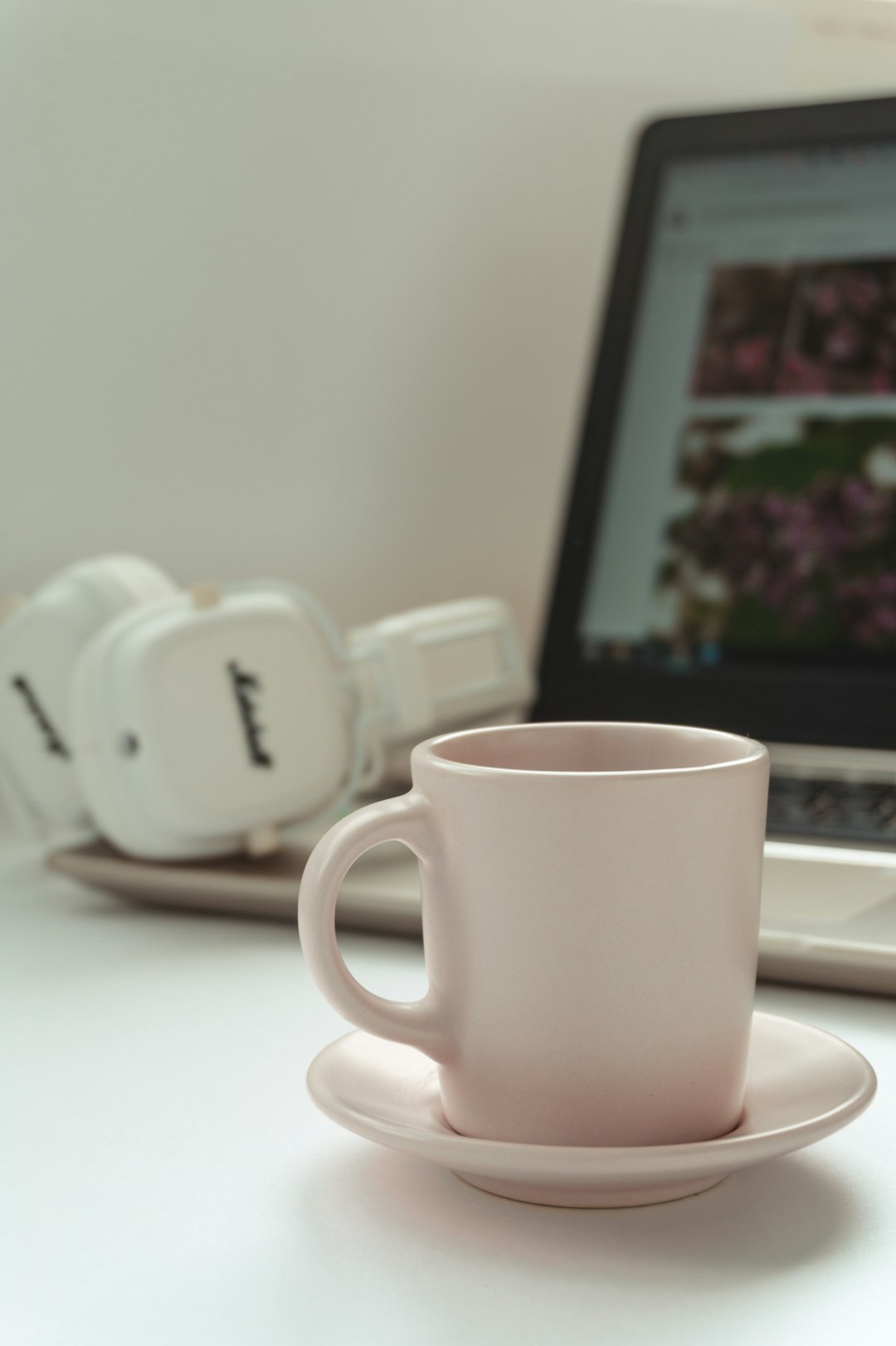 white ceramic mug on white table