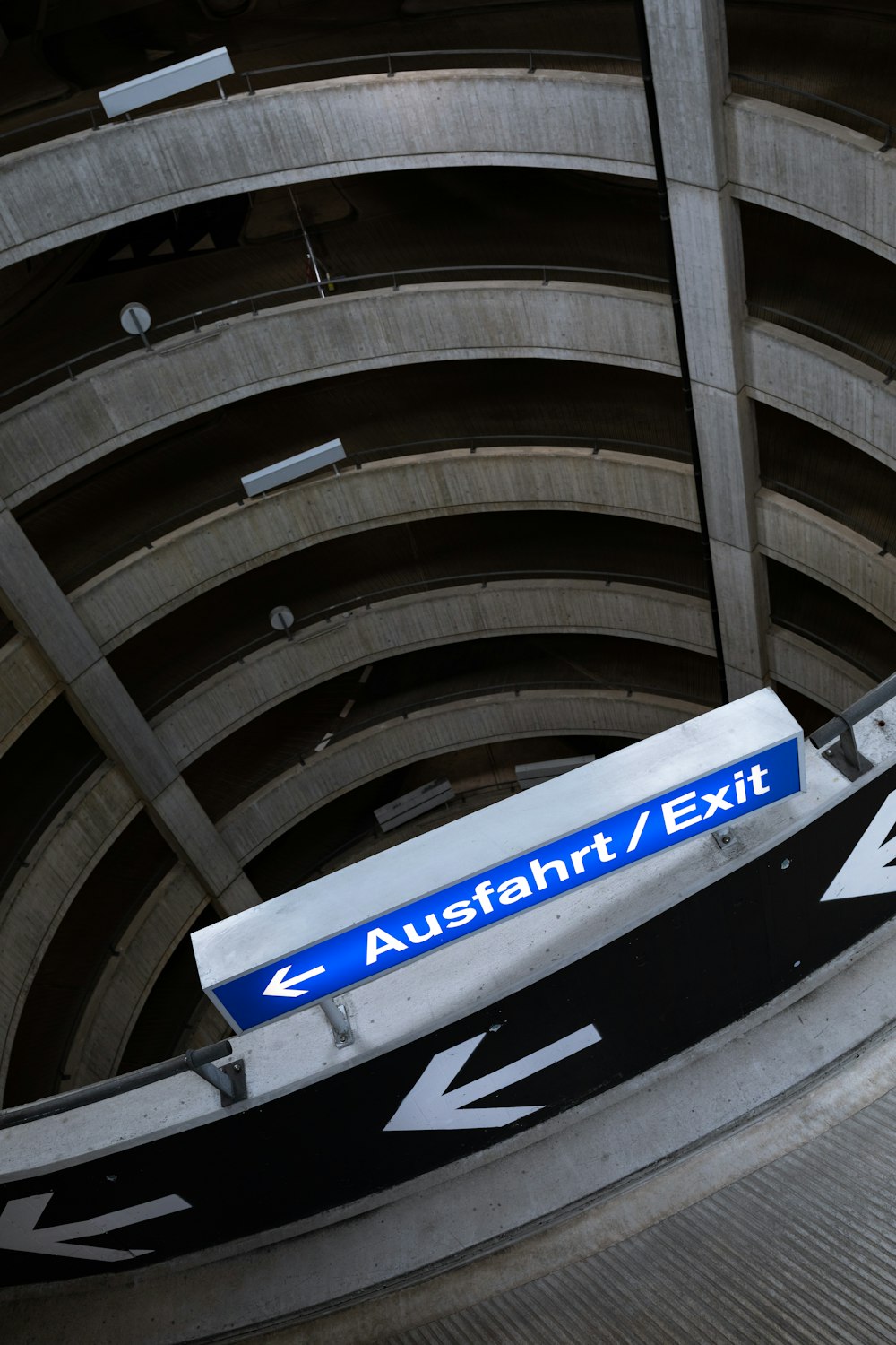 a blue and white sign that is on a pole