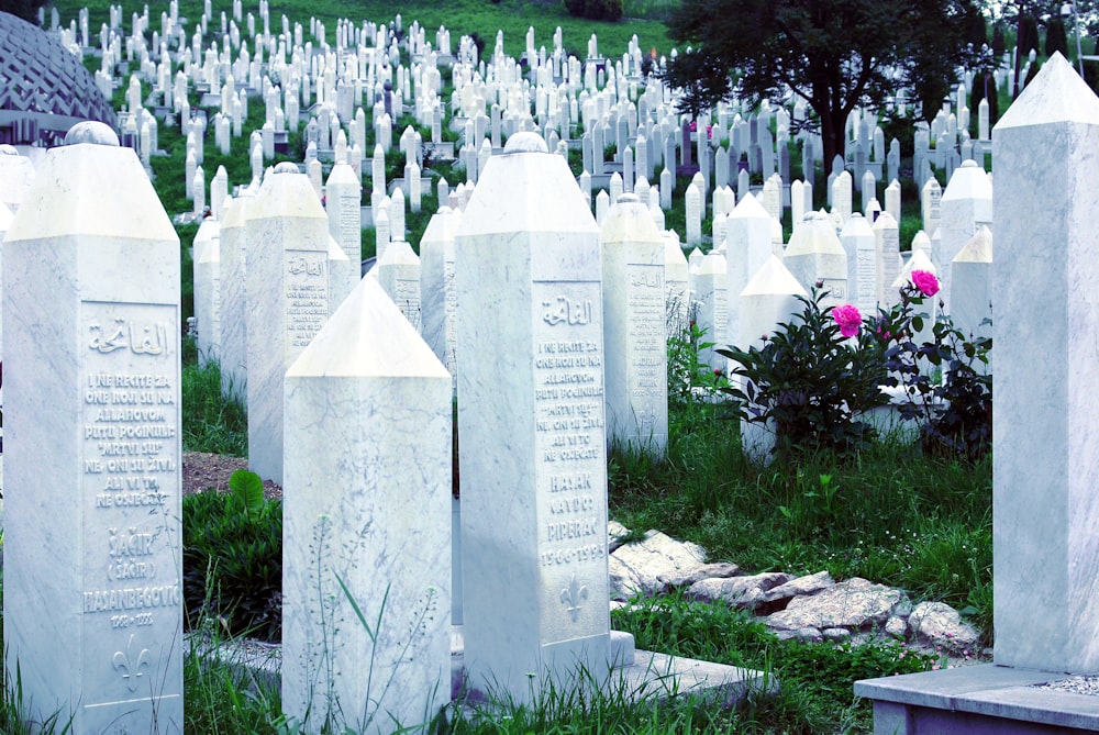 white tomb stone on green grass during daytime