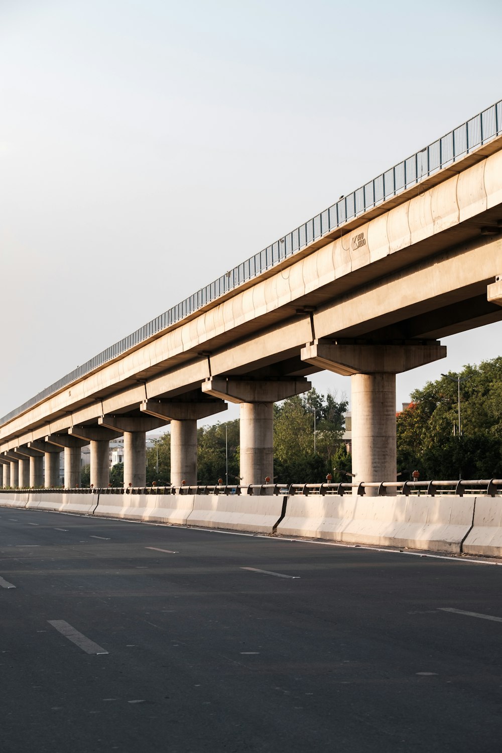 white concrete bridge under white sky during daytime