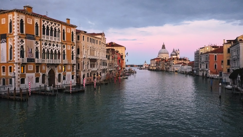 body of water between buildings during daytime