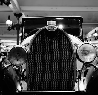 grayscale photo of vintage car