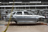 white sedan on a parking lot