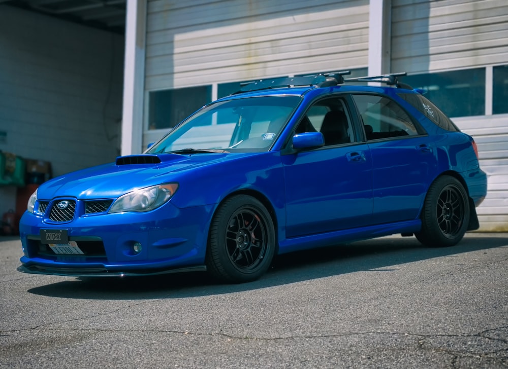 blue bmw m 3 parked on parking lot during daytime