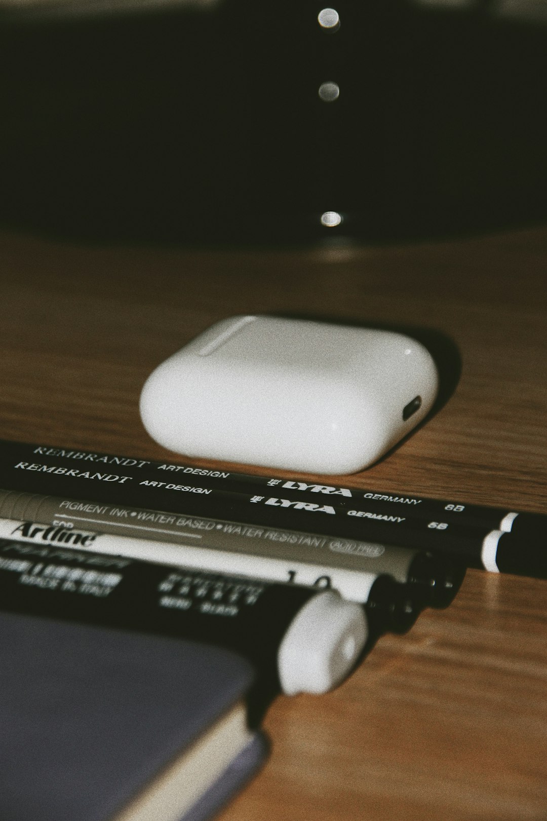 white and black electronic device on brown wooden table