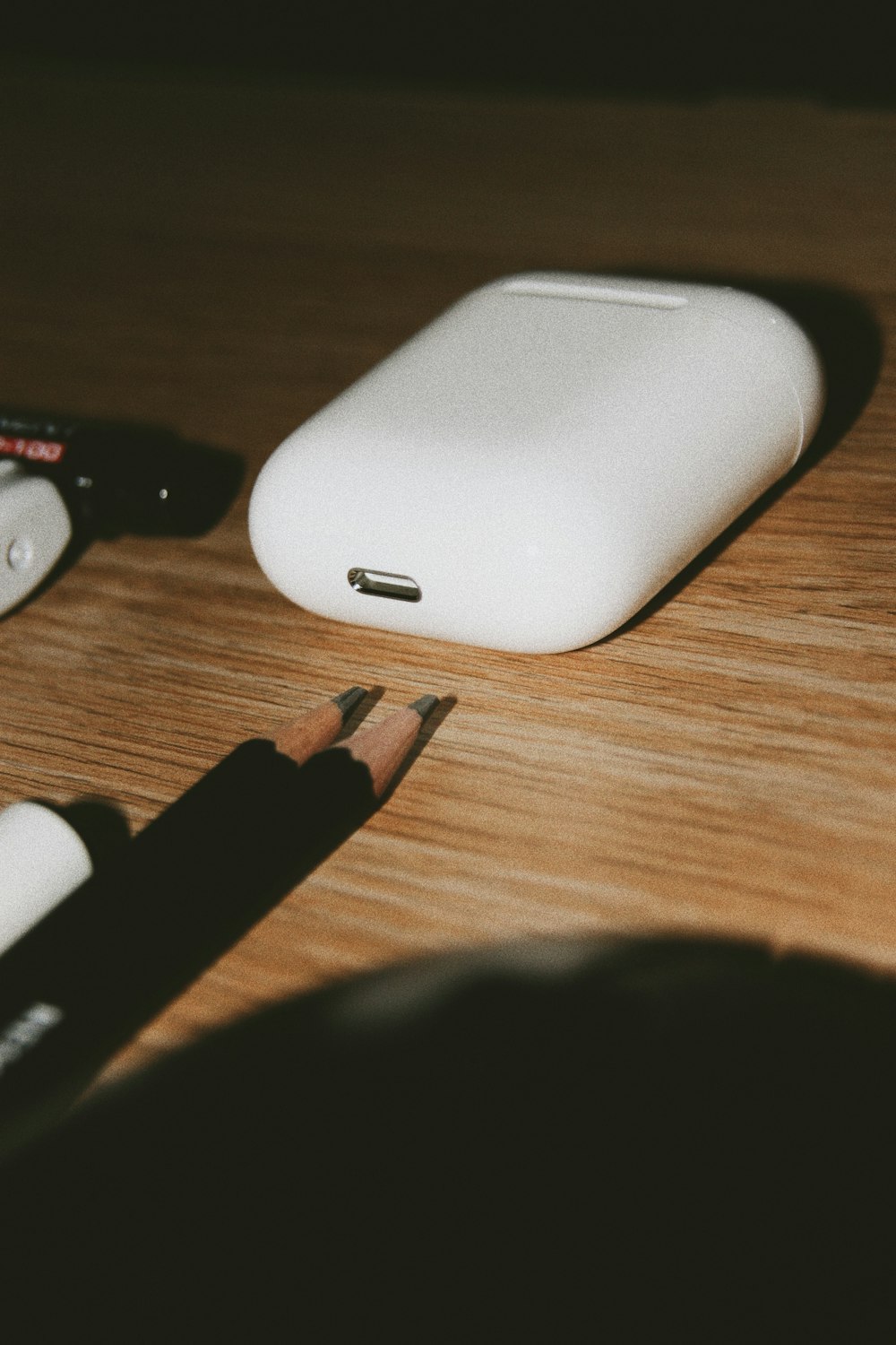 white mobile charger on brown wooden table